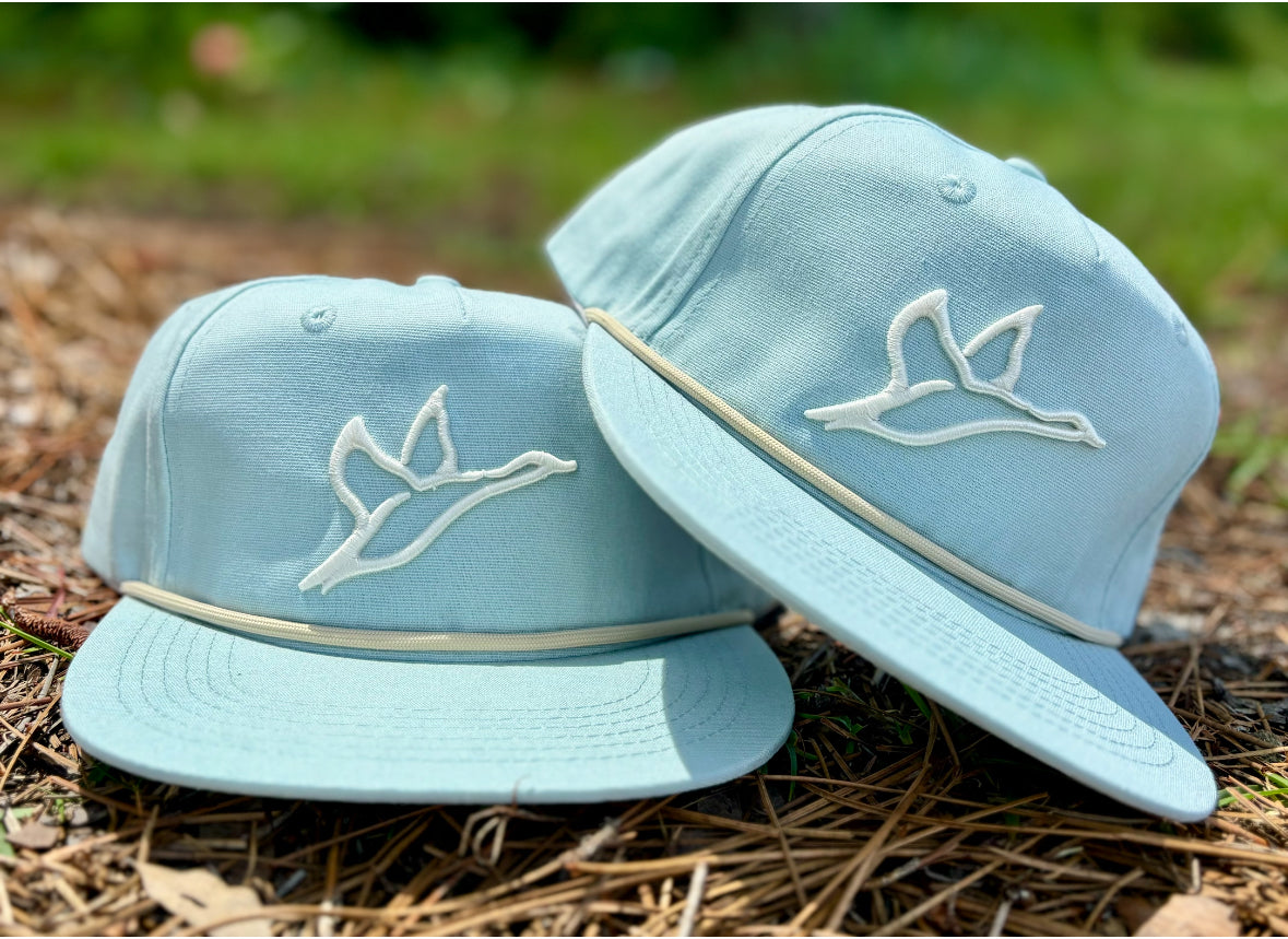 Two Goat Rope Tarpon blue rope hats with white embroidered duck icons, structured front, and snapback closure.